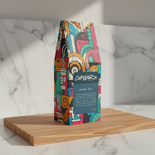 colorful bag of specialty colombian coffee on wooden board